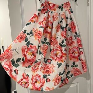 High Waisted Floral Skirt. Can tie bow front or back. Worn less than 5 times.